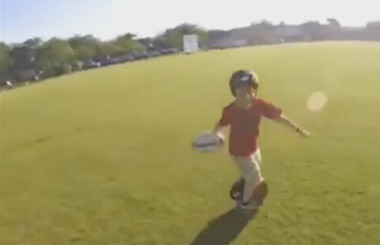 The teenager shows his riding skills by catching balls on self-balancing electric scooter.